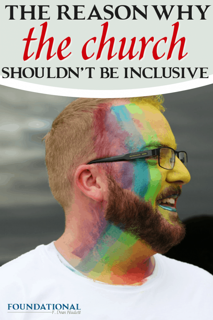 Man with a rainbow painted on his face