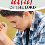 young man hands folded in prayer