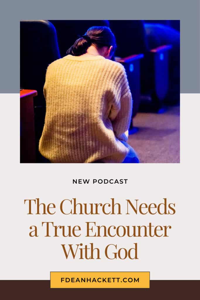 Person kneeling in aisle of the church