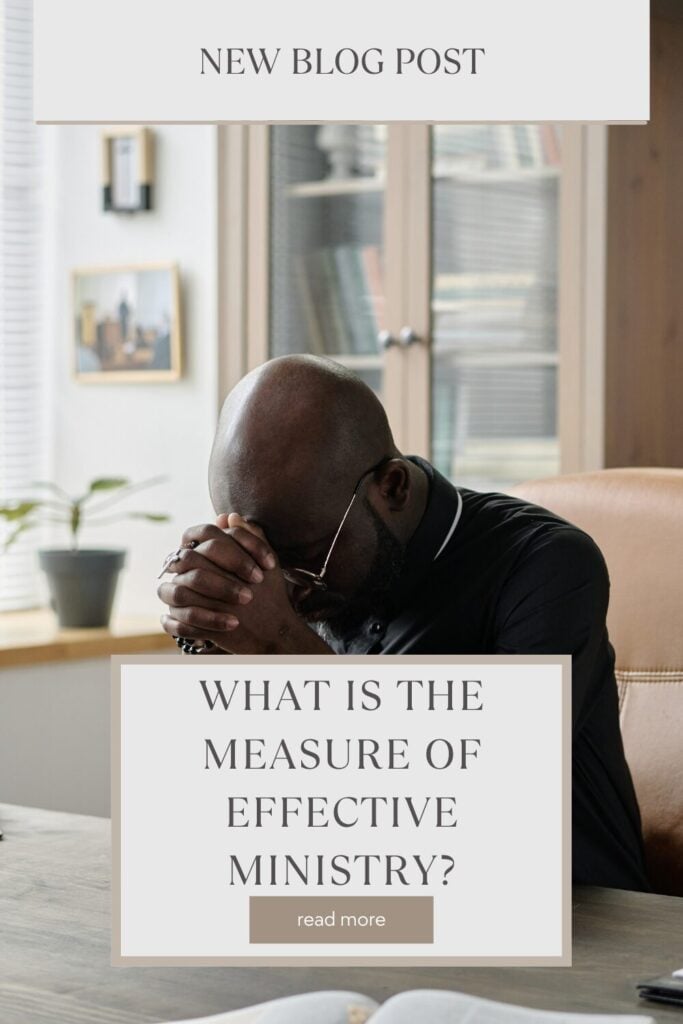 pastor sitting at his desk praying