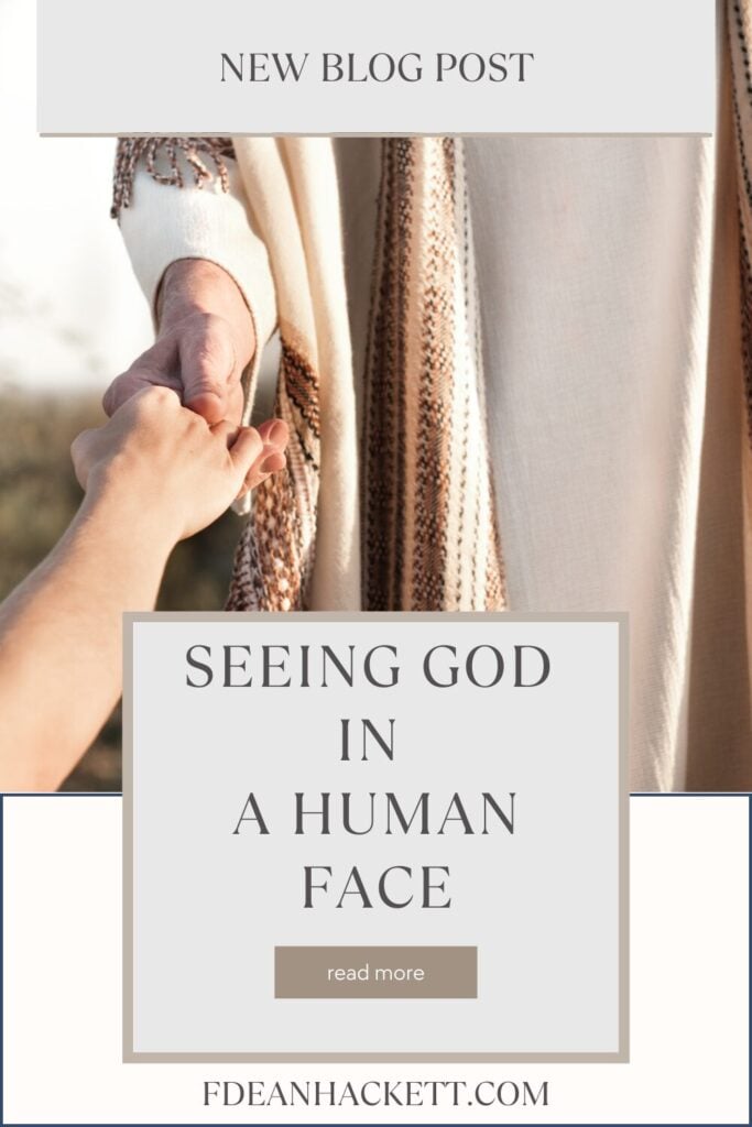 Picture of Jesus' hand reaching out holding a human hand, because the person is seeing God in a human face