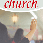 people raising hands in church