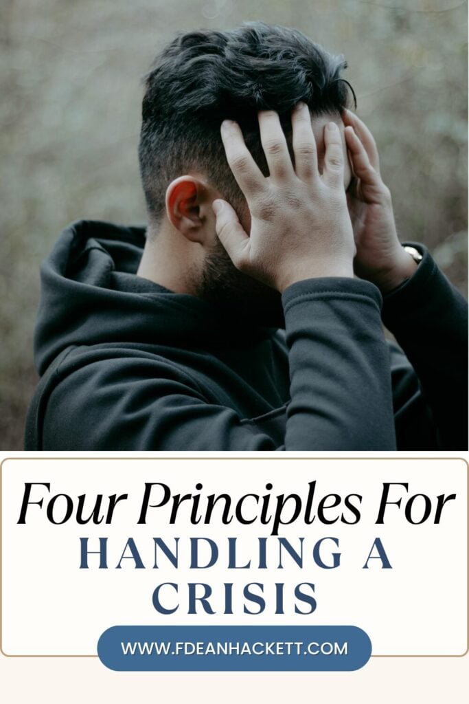 Man with hands on head handling a crisis
