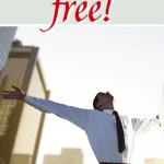 Man in white shirt and red tie outside in the middle of buildings raising his hands