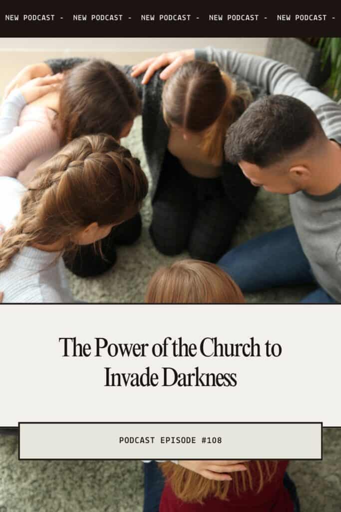 People kneeling in a circle praying