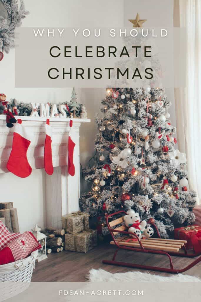 Christmas tree and red stockings on the fireplace in a living room with a white aesthetic. 