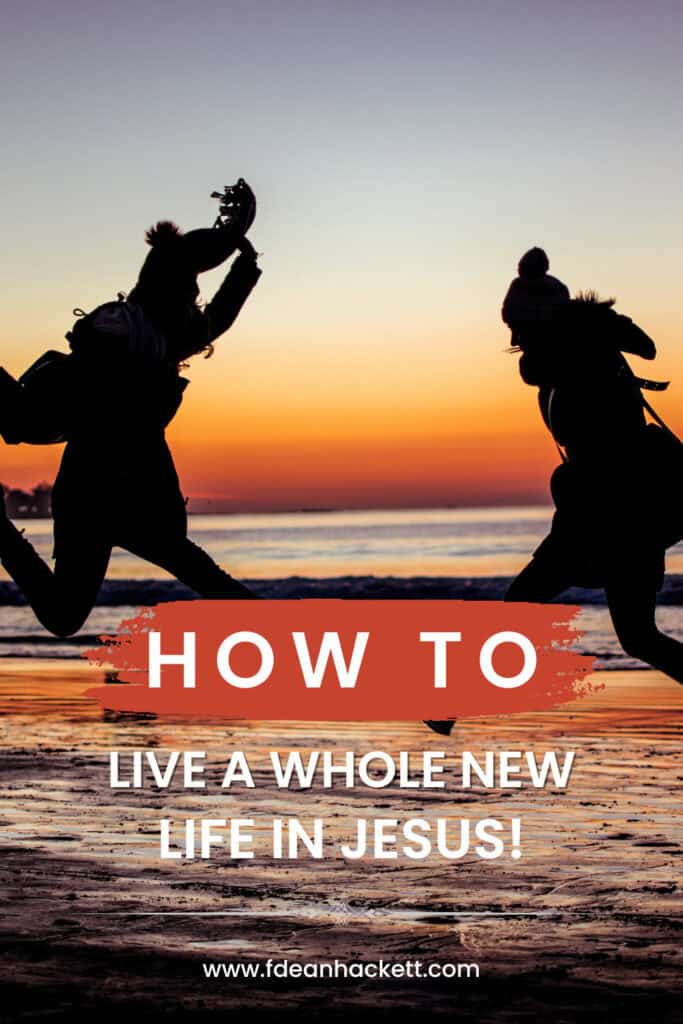 two people jumping in the ocean