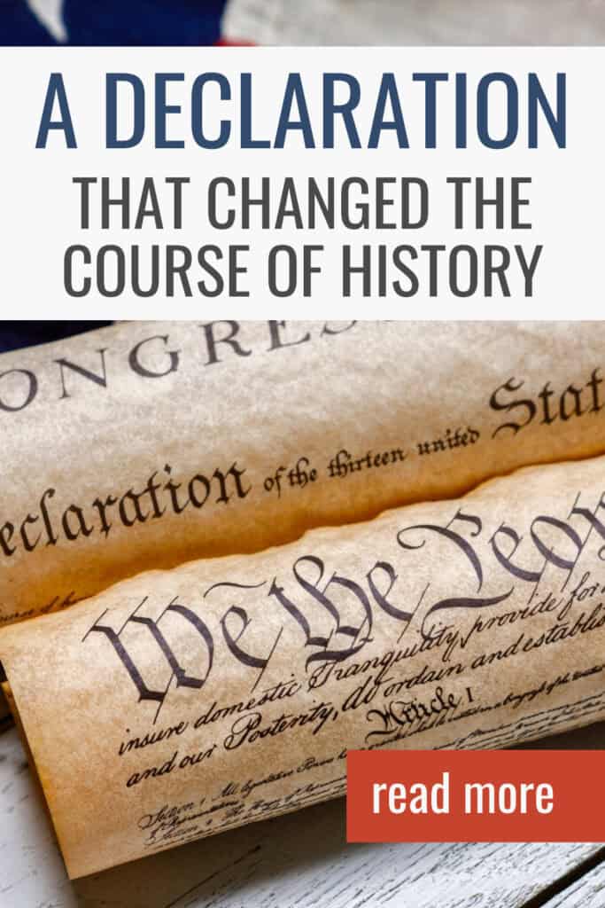 America's founding documents laid against a background of the American Flag