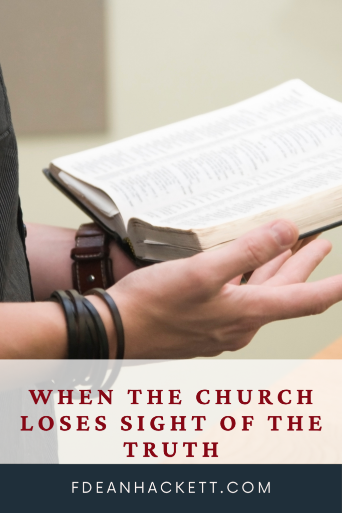 man holding a Bible when the church loses sight of the truth
